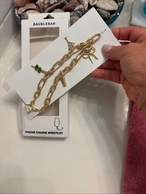 BaubleBar Gold Chain Phone Charm Wristlet with Green Accent